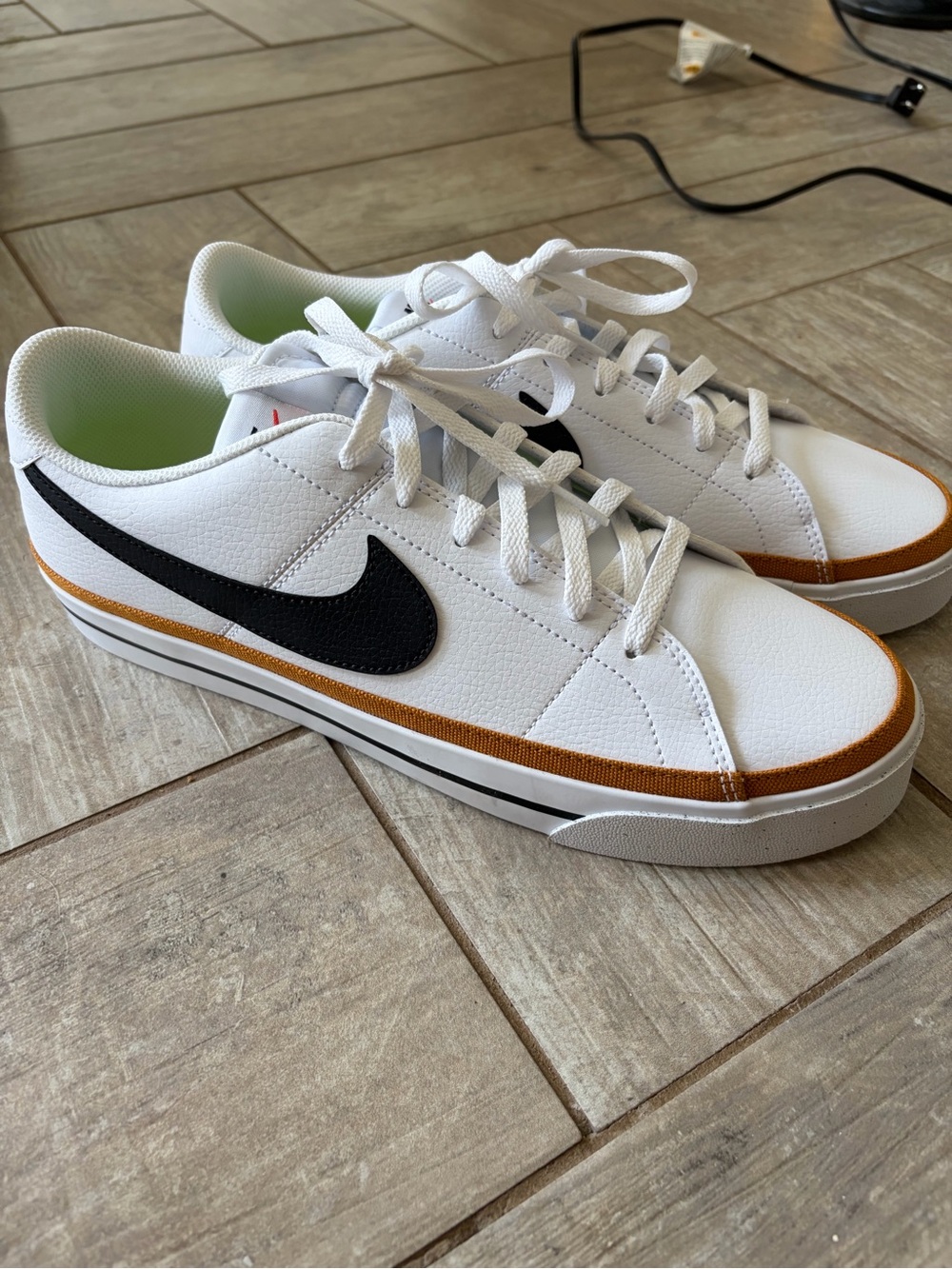 Nike White Sneakers with Black Swoosh and Brown Trim
